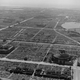 An aerial photo of Tokyo showing the devastation of the incendiary attacks.